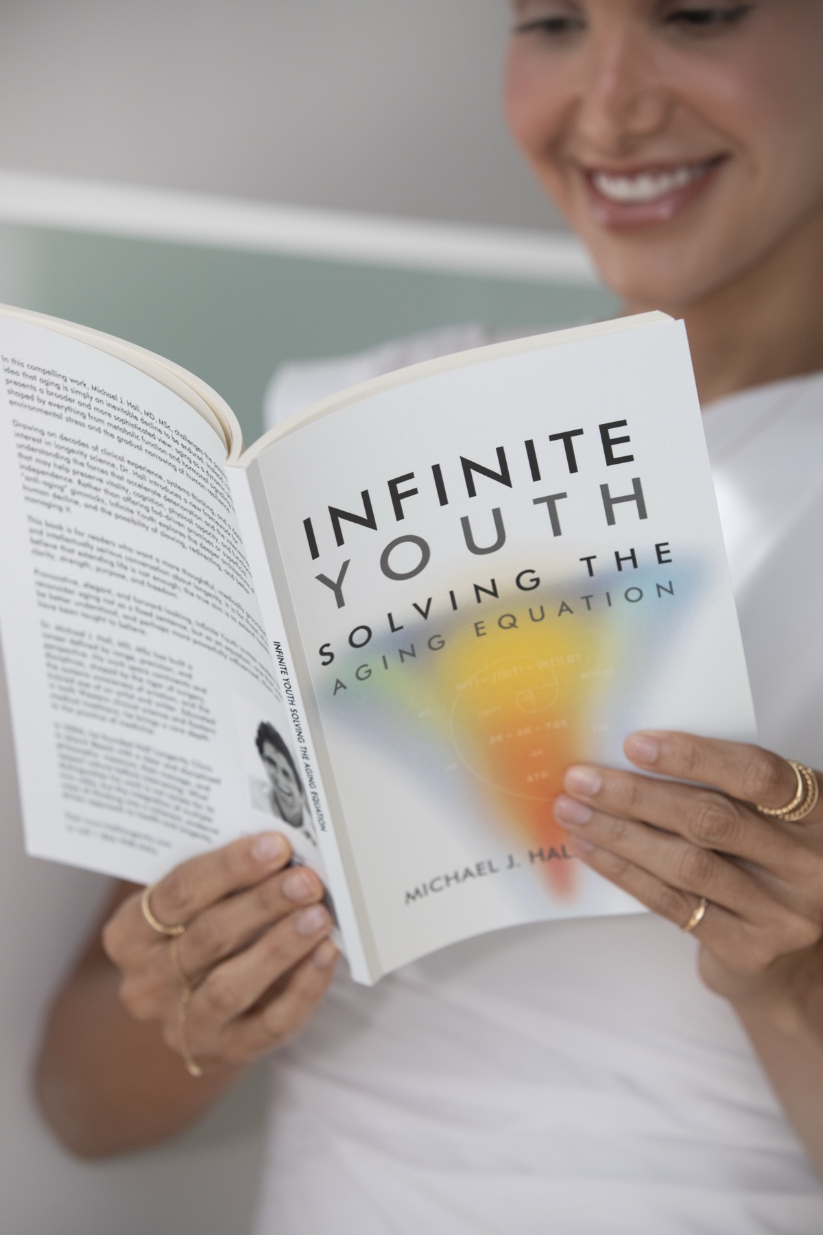 A reader enjoying Infinite Youth: Solving the Aging Equation by Dr. Michael J. Hall